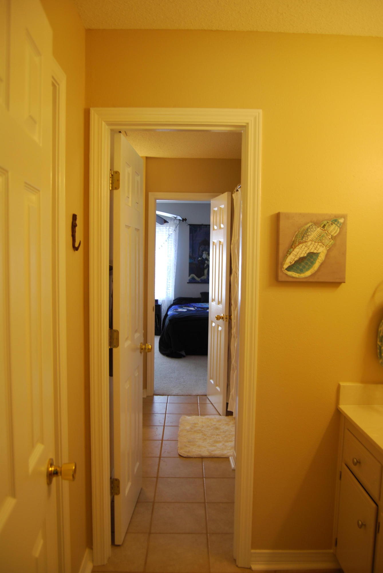 4455 Kingslynn Road Niceville, FL 32578 - Photo 26 of 36 a view of a bathroom from the hallway