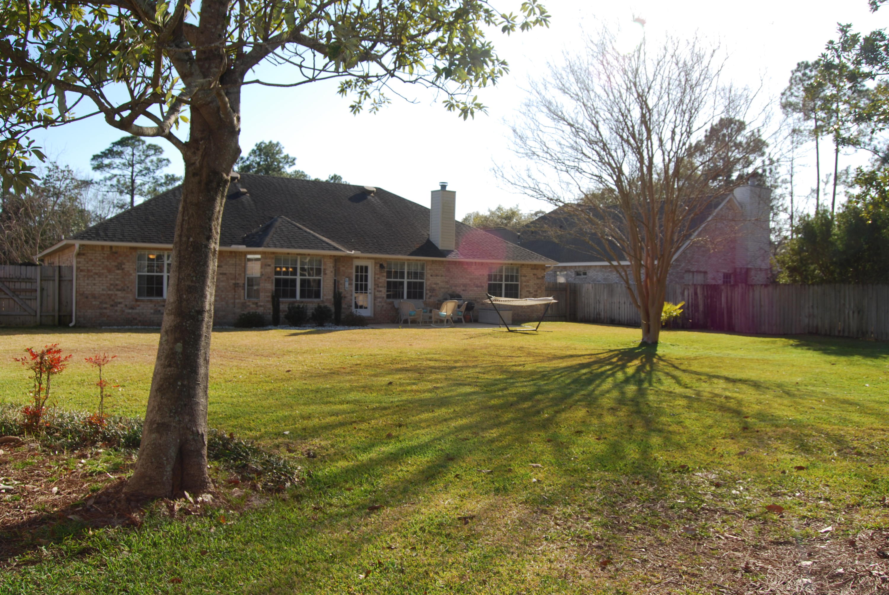 4455 Kingslynn Road Niceville, FL 32578 - Photo 31 of 36 a view of a house with a yard