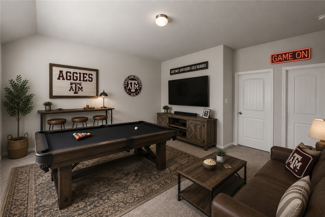 4702 Nopalitos Way Bryan, TX 77807 - Photo 17 of 27 a living room with furniture a rug and a flat screen tv
