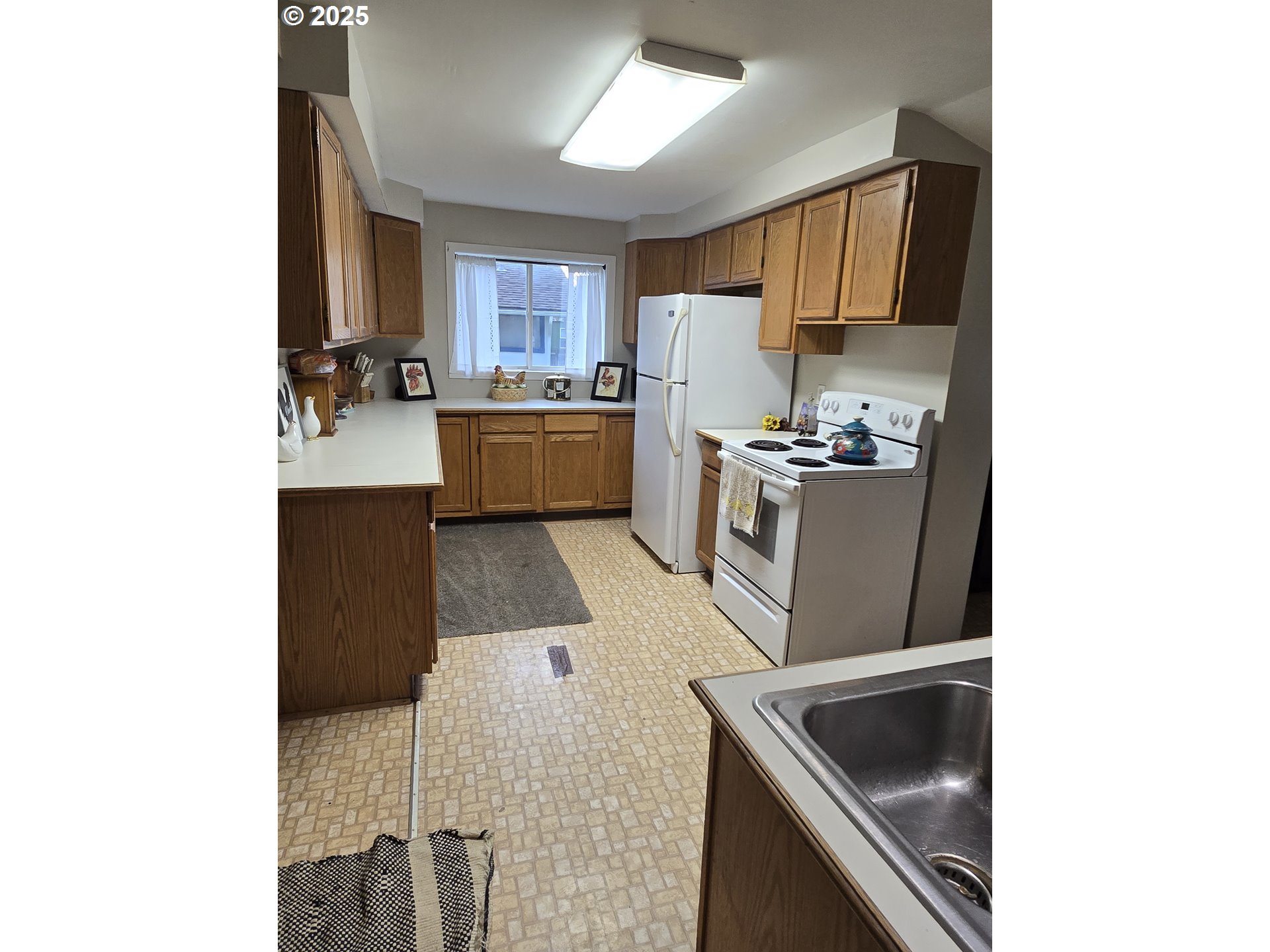 515 West Main Street Enterprise, OR 97828 - Photo 11 of 22 a kitchen with stainless steel appliances granite countertop a sink and a stove