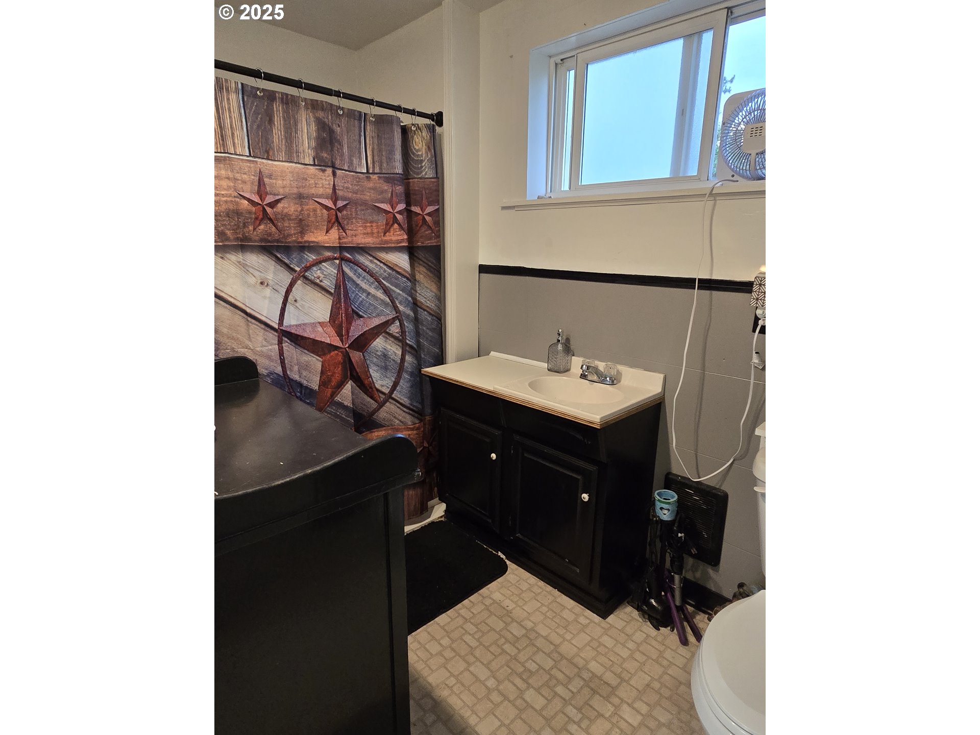 515 West Main Street Enterprise, OR 97828 - Photo 12 of 22 a bathroom with a sink and a mirror