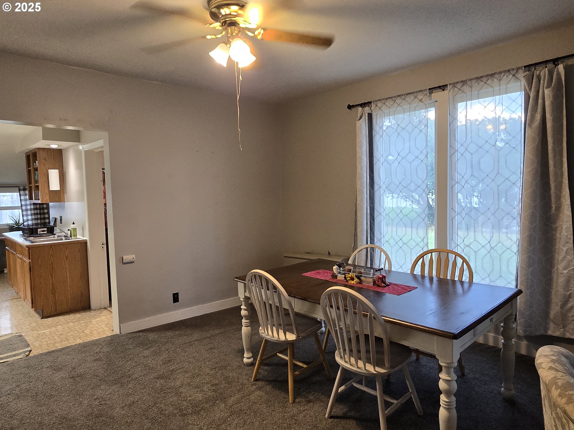 515 West Main Street Enterprise, OR 97828 - Photo 13 of 22 a view of a dining room with furniture and chandelier