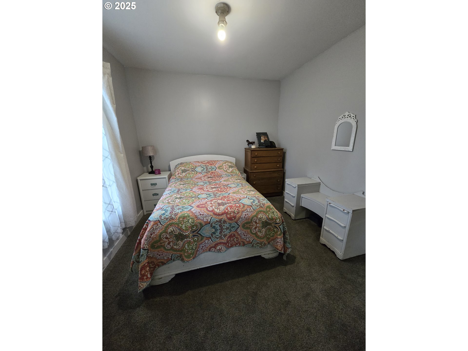 515 West Main Street Enterprise, OR 97828 - Photo 14 of 22 a bedroom with a bed and a window