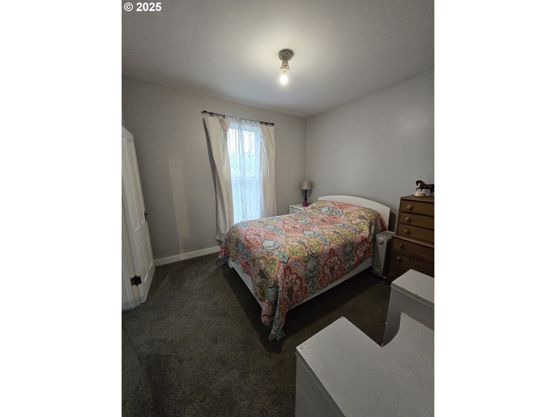 515 West Main Street Enterprise, OR 97828 - Photo 15 of 22 a bedroom with a bed and a window