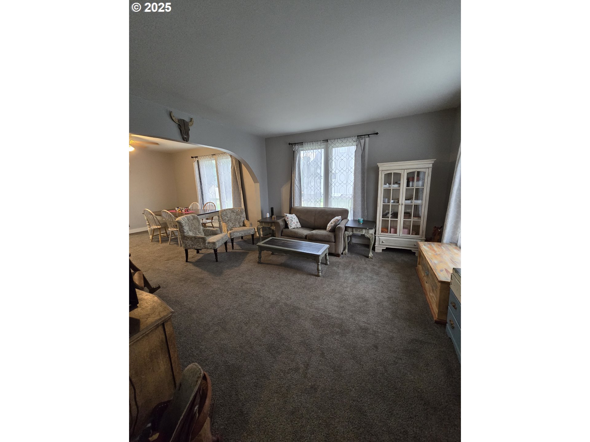 515 West Main Street Enterprise, OR 97828 - Photo 8 of 22 a living room with furniture and a large window