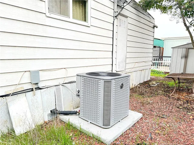 a front view of a house with wooden fence