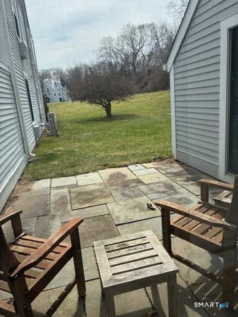 a view of a backyard with wooden floor