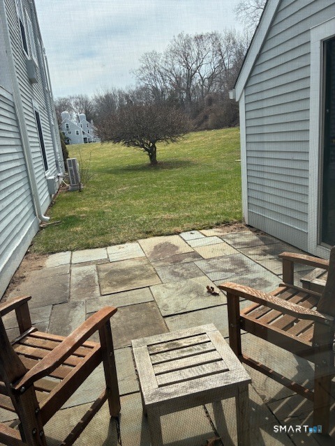 7 River Colony, Unit 7 Guilford, CT 06437 - Photo 19 of 23 a view of a backyard with wooden floor