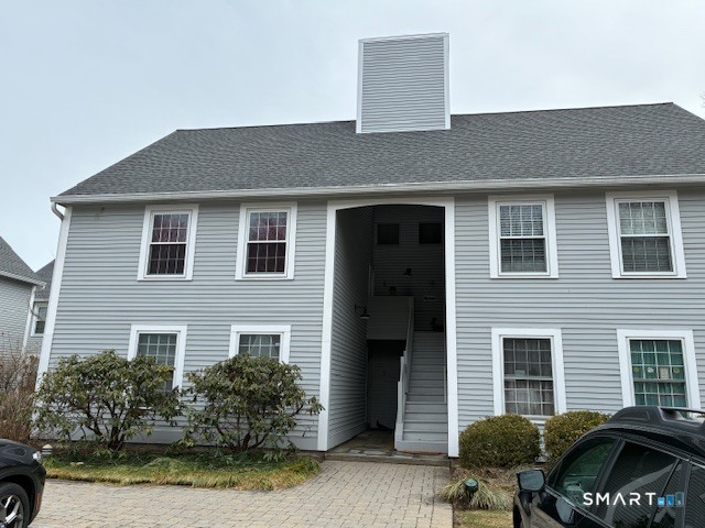 7 River Colony, Unit 7 Guilford, CT 06437 - Photo 2 of 23 a front view of a house with garden