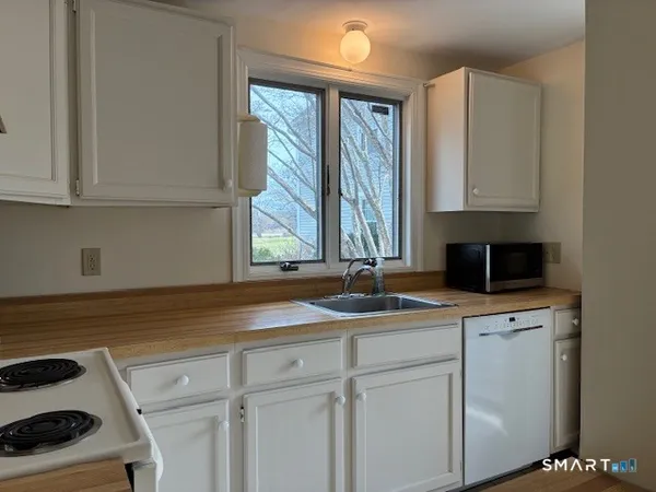 a kitchen with a sink and cabinets