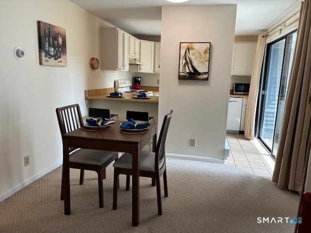 7 River Colony, Unit 7 Guilford, CT 06437 - Photo 6 of 23 a dining room with furniture and window