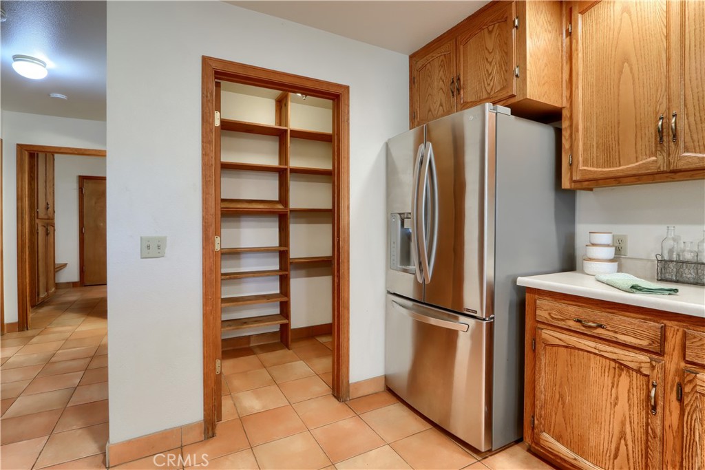 5857 Allred Road Mariposa, CA 95338 - Photo 13 of 62 a kitchen with stainless steel appliances granite countertop a refrigerator and a sink