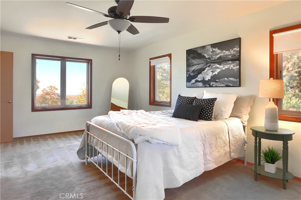 5857 Allred Road Mariposa, CA 95338 - Photo 18 of 62 a bedroom with a bed and a painting on the wall