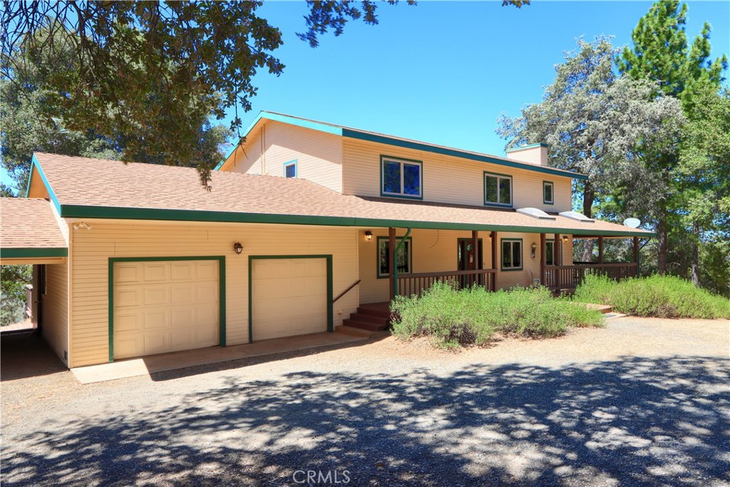 5857 Allred Road Mariposa, CA 95338 - Photo 2 of 62 a front view of a house with a yard and garage
