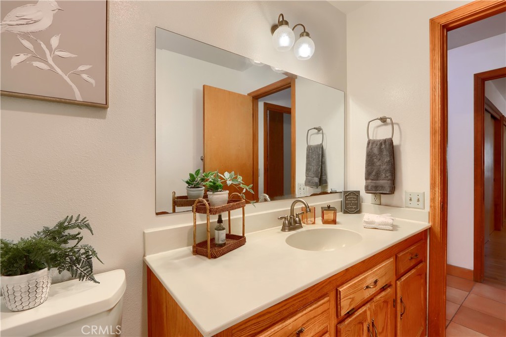5857 Allred Road Mariposa, CA 95338 - Photo 26 of 62 a bathroom with a sink and a mirror