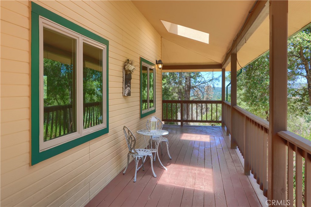 5857 Allred Road Mariposa, CA 95338 - Photo 37 of 62 a view of a patio with a table chairs and wooden floor