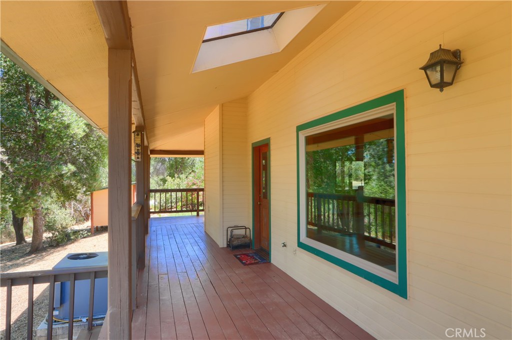 5857 Allred Road Mariposa, CA 95338 - Photo 39 of 62 a view of a porch with wooden floor and outdoor space