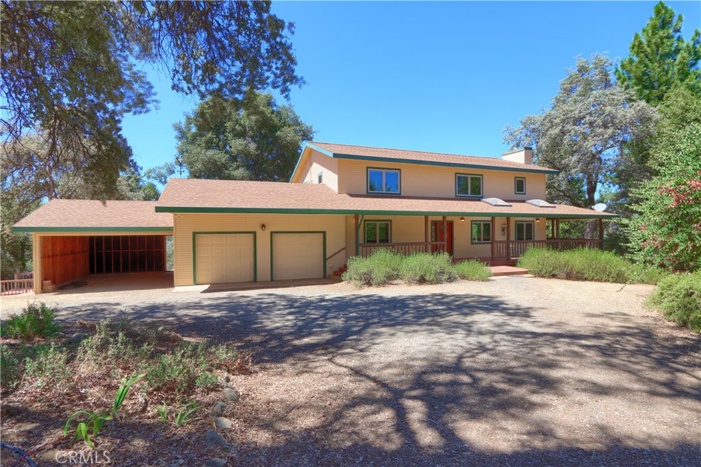 5857 Allred Road Mariposa, CA 95338 - Photo 48 of 62 a front view of a house with a yard and a garage