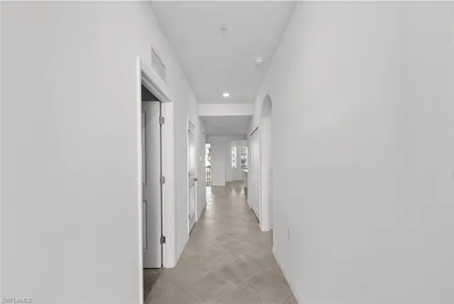 a kitchen with a sink cabinets and stainless steel appliances