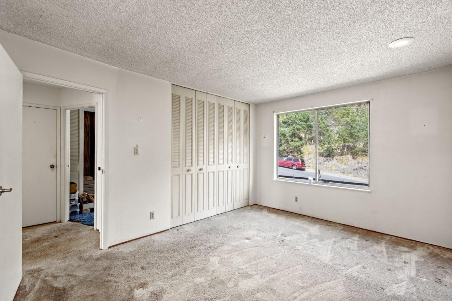 107 Hickey Boulevard Pacifica, CA 94044 - Photo 13 of 29 an empty room with windows