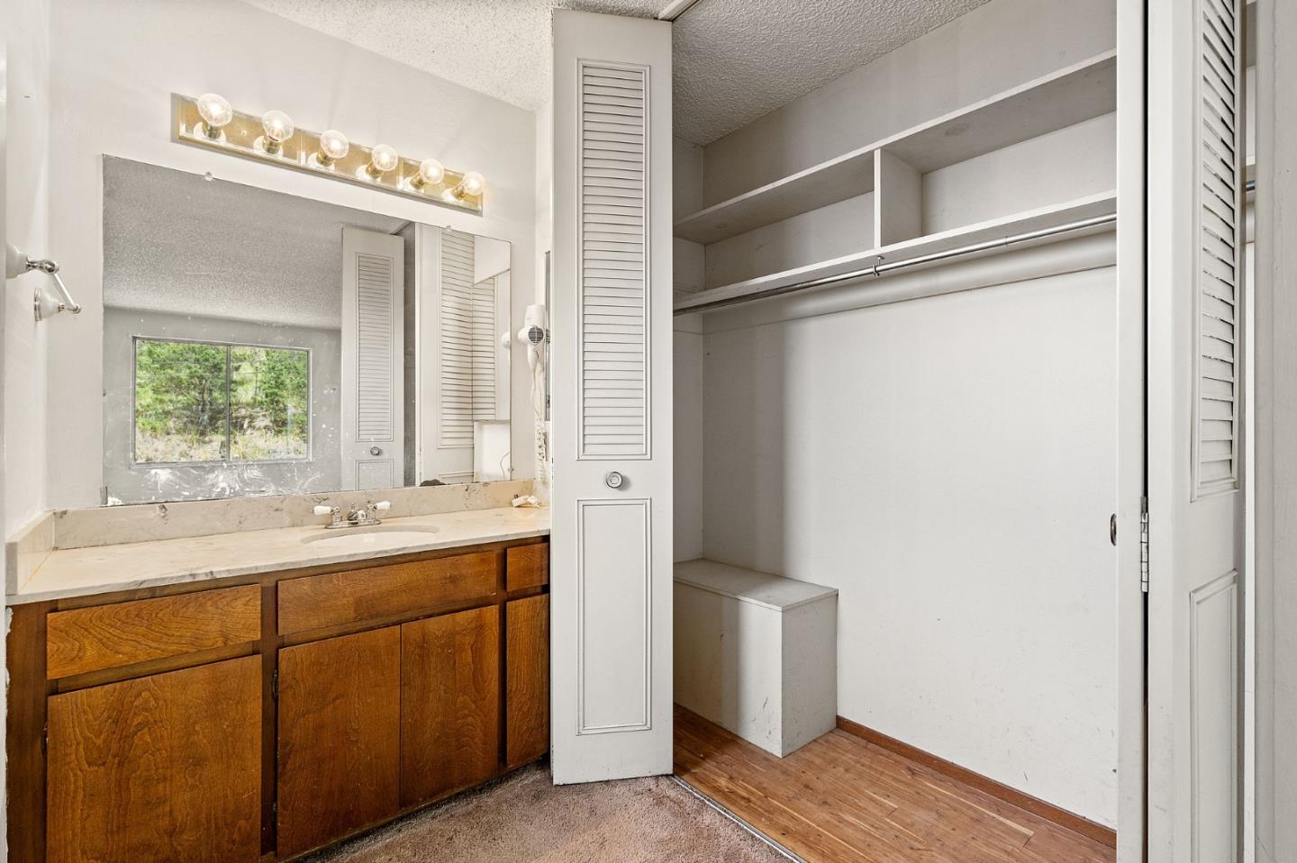 107 Hickey Boulevard Pacifica, CA 94044 - Photo 15 of 29 a bathroom with a sink and a mirror