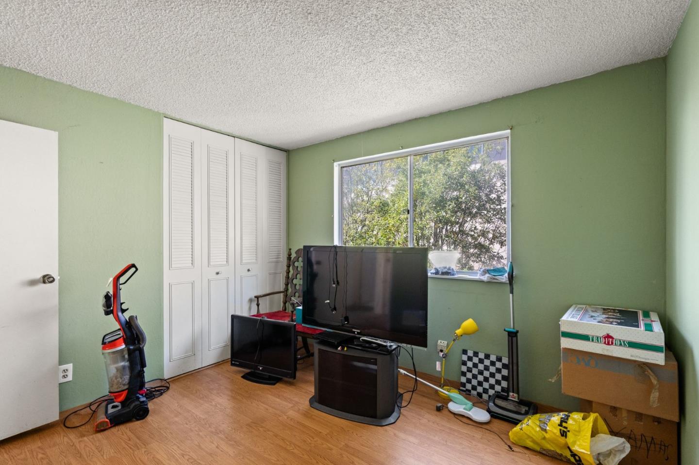 107 Hickey Boulevard Pacifica, CA 94044 - Photo 19 of 29 a living room with furniture and a flat screen tv