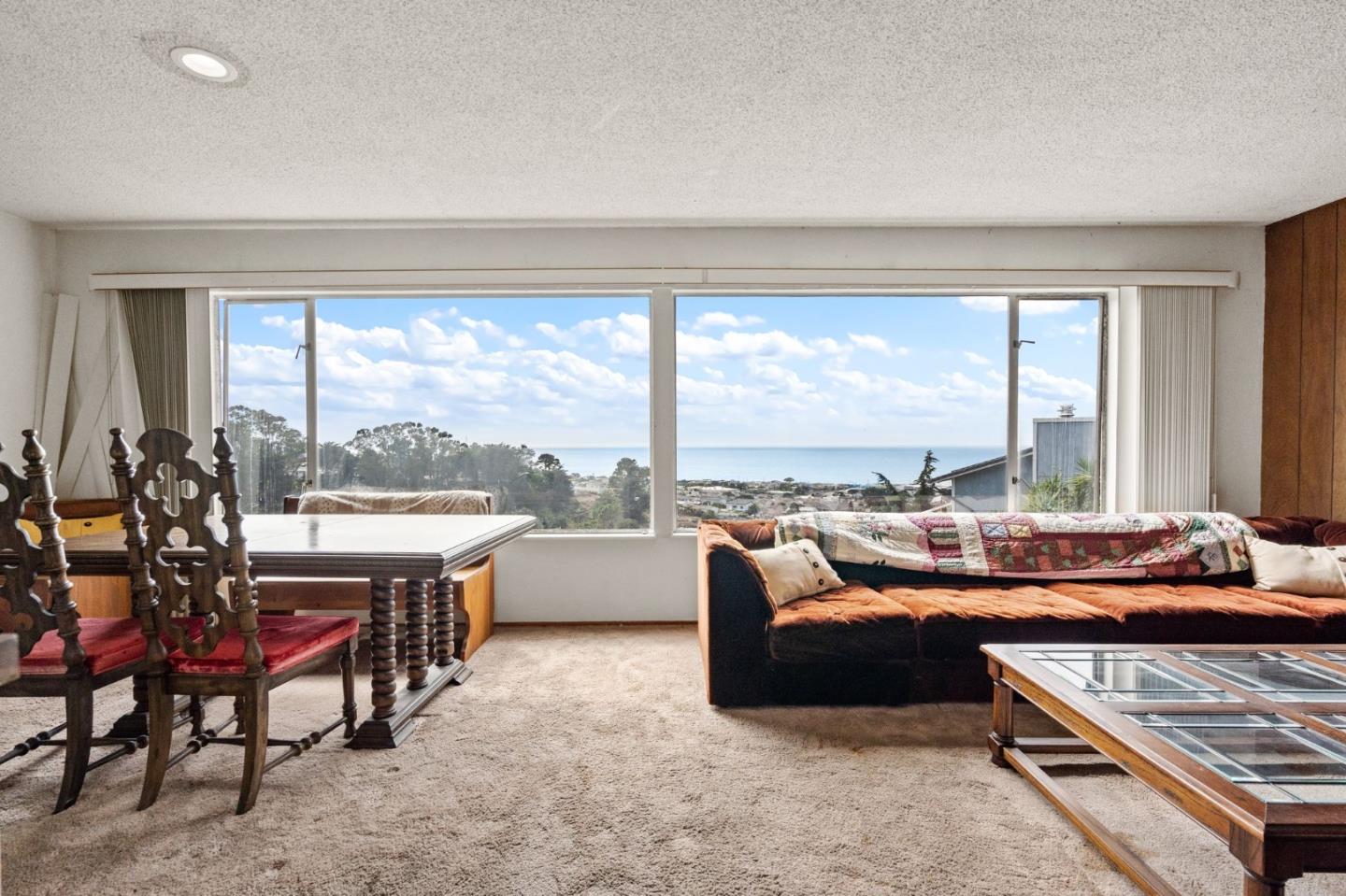 107 Hickey Boulevard Pacifica, CA 94044 - Photo 6 of 29 a living room with furniture and a large window