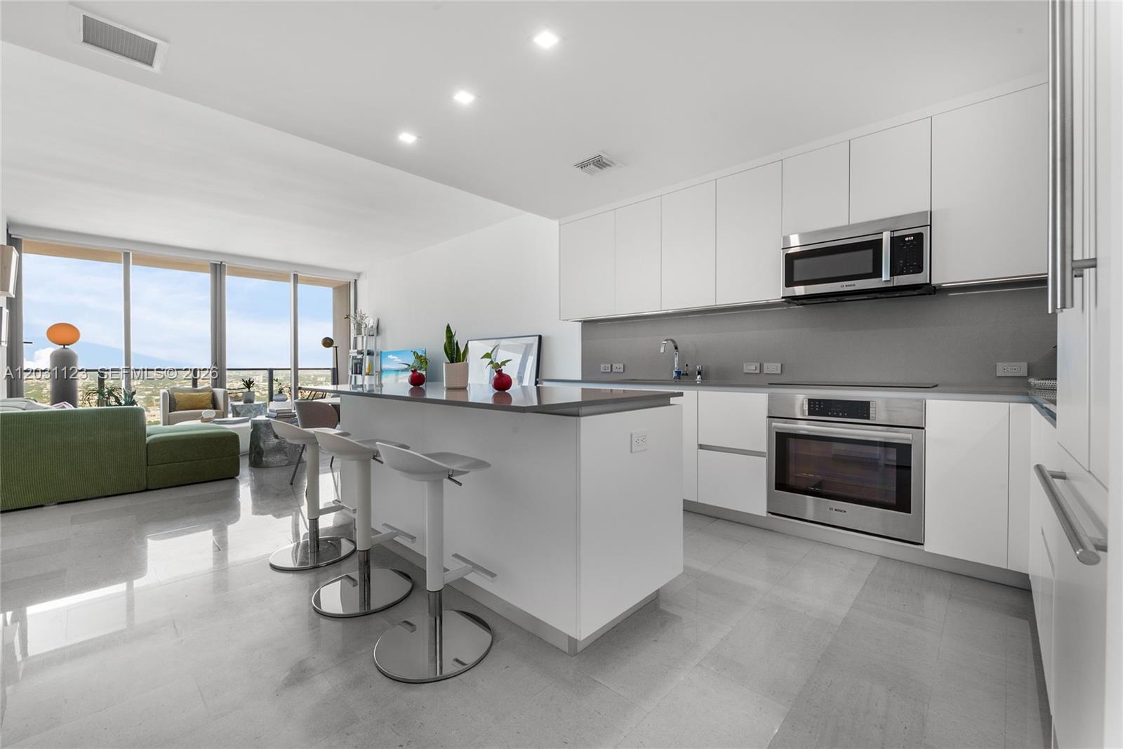 88 Southwest 7th Street, Unit 3208 Miami, FL 33130 - Photo 3 of 16 a kitchen with a sink cabinets and window