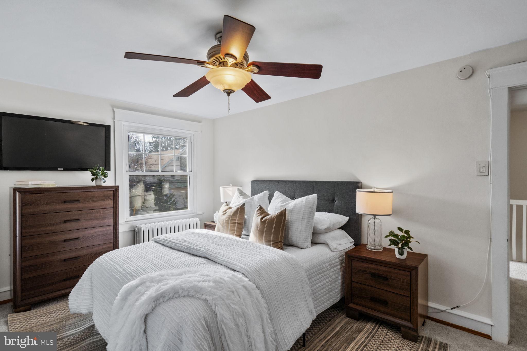 530 East Manoa Road Havertown, PA 19083 - Photo 16 of 32 a bedroom with a bed and a flat tv screen on dresser