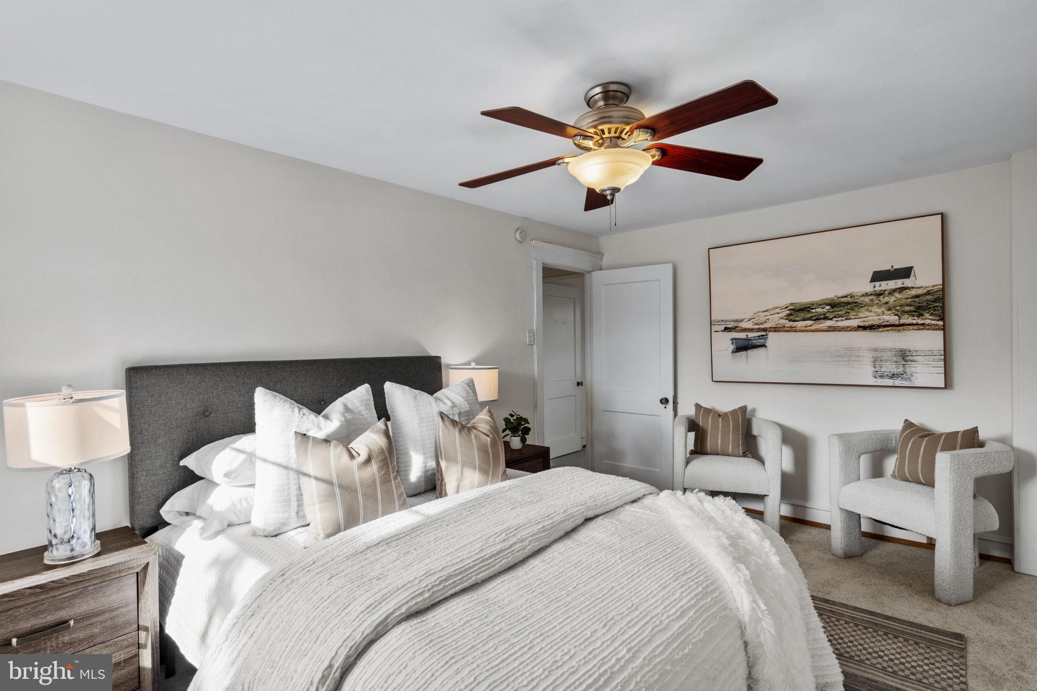 530 East Manoa Road Havertown, PA 19083 - Photo 17 of 32 a bedroom with bed and a chandelier