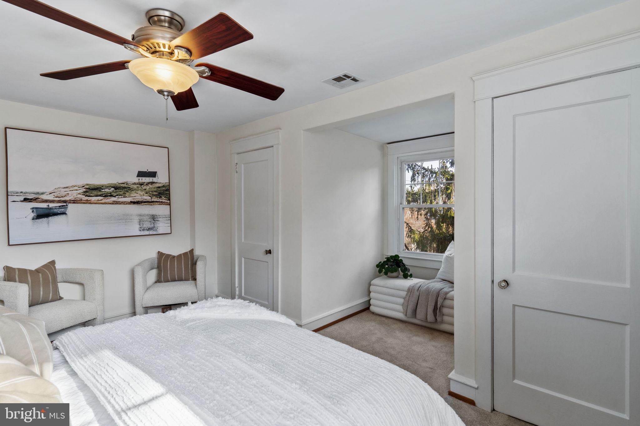 530 East Manoa Road Havertown, PA 19083 - Photo 18 of 32 a bedroom with a bed and a chandelier