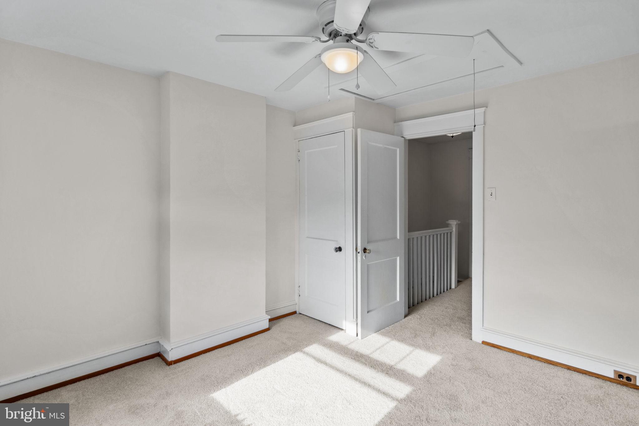 530 East Manoa Road Havertown, PA 19083 - Photo 24 of 32 an empty room with a ceiling fan and window