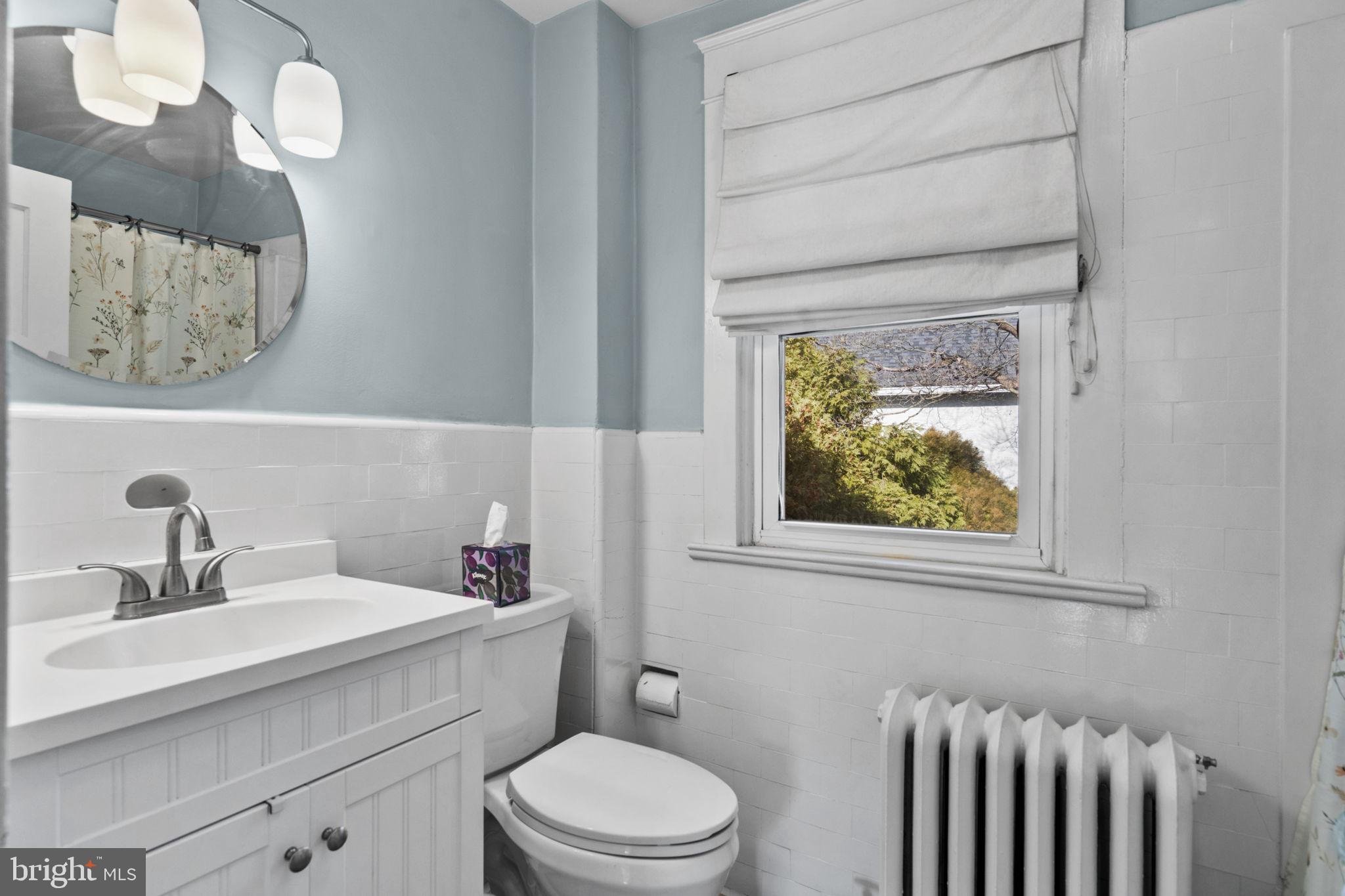 530 East Manoa Road Havertown, PA 19083 - Photo 25 of 32 a bathroom with a sink a toilet and a mirror
