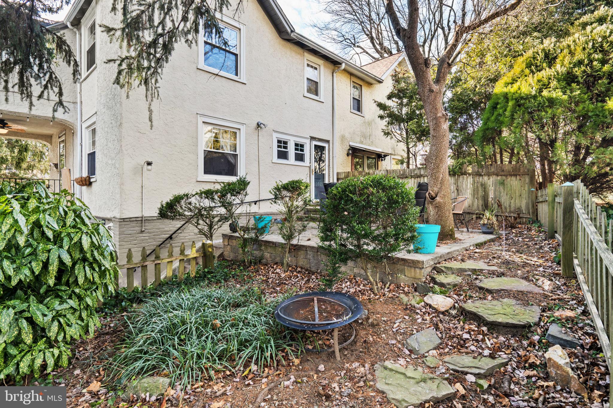 530 East Manoa Road Havertown, PA 19083 - Photo 28 of 32 a backyard of a house with garden and outdoor seating