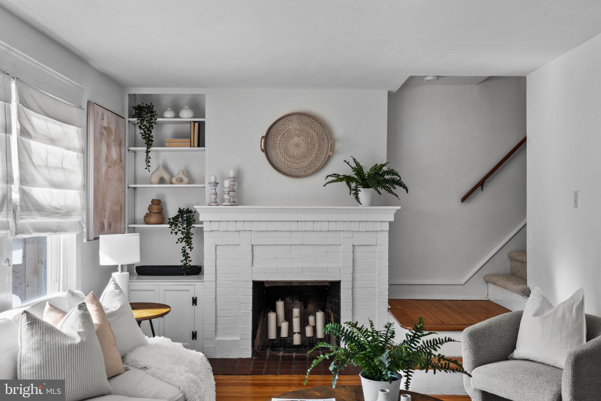 530 East Manoa Road Havertown, PA 19083 - Photo 7 of 32 a living room with furniture a fireplace and a large window