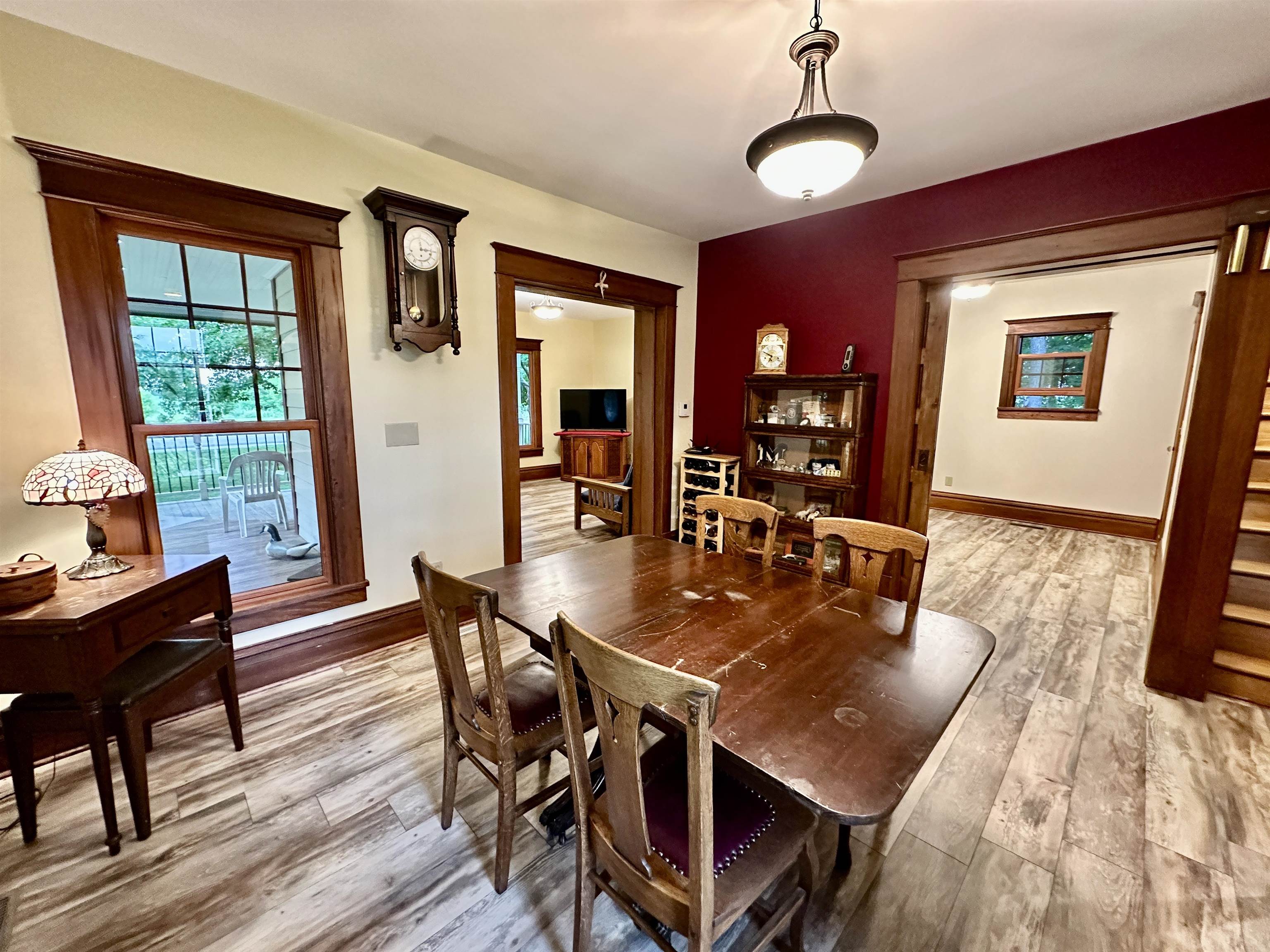 4415 Genoa Road Belvidere, IL 61008 - Photo 11 of 51 a dining room with furniture a chandelier and wooden floor