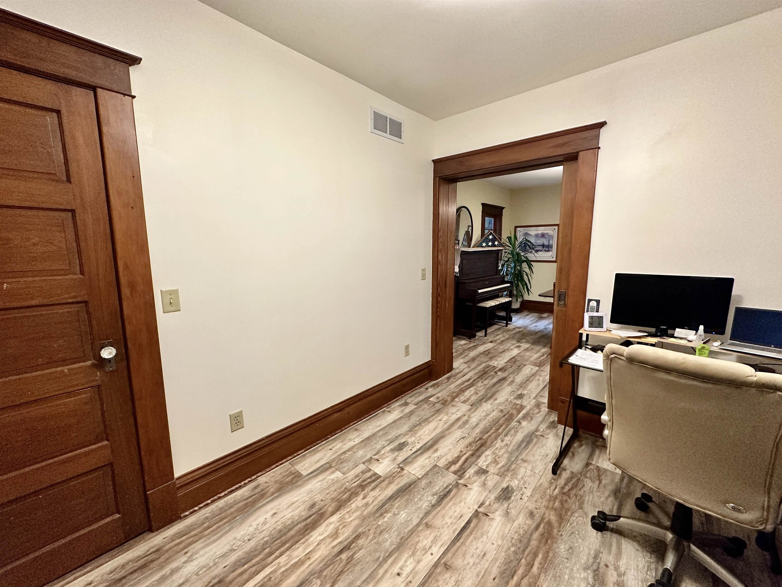 4415 Genoa Road Belvidere, IL 61008 - Photo 15 of 51 a workspace with furniture and wooden floor
