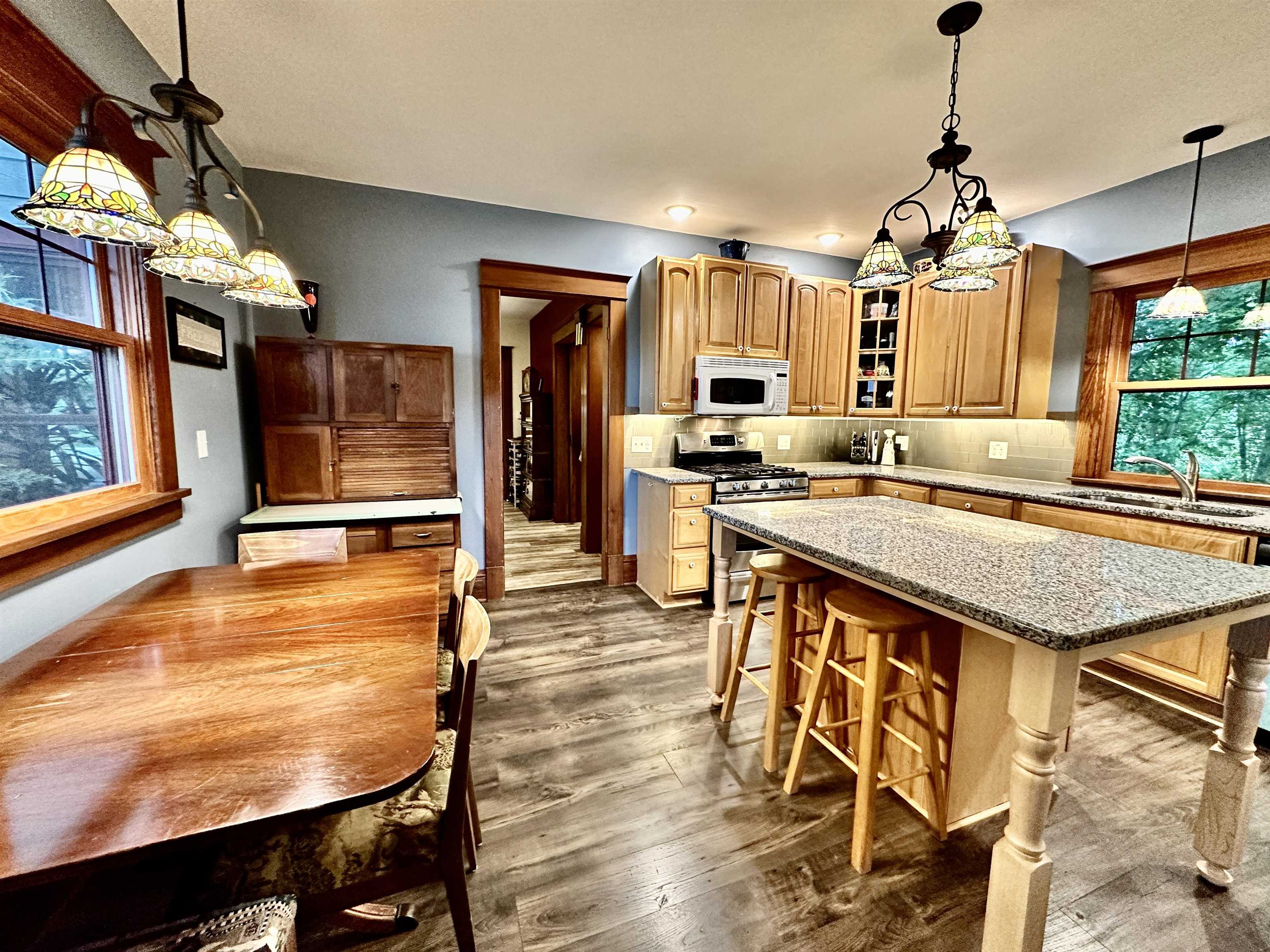 4415 Genoa Road Belvidere, IL 61008 - Photo 18 of 51 a kitchen with stainless steel appliances granite countertop a stove a sink and a refrigerator