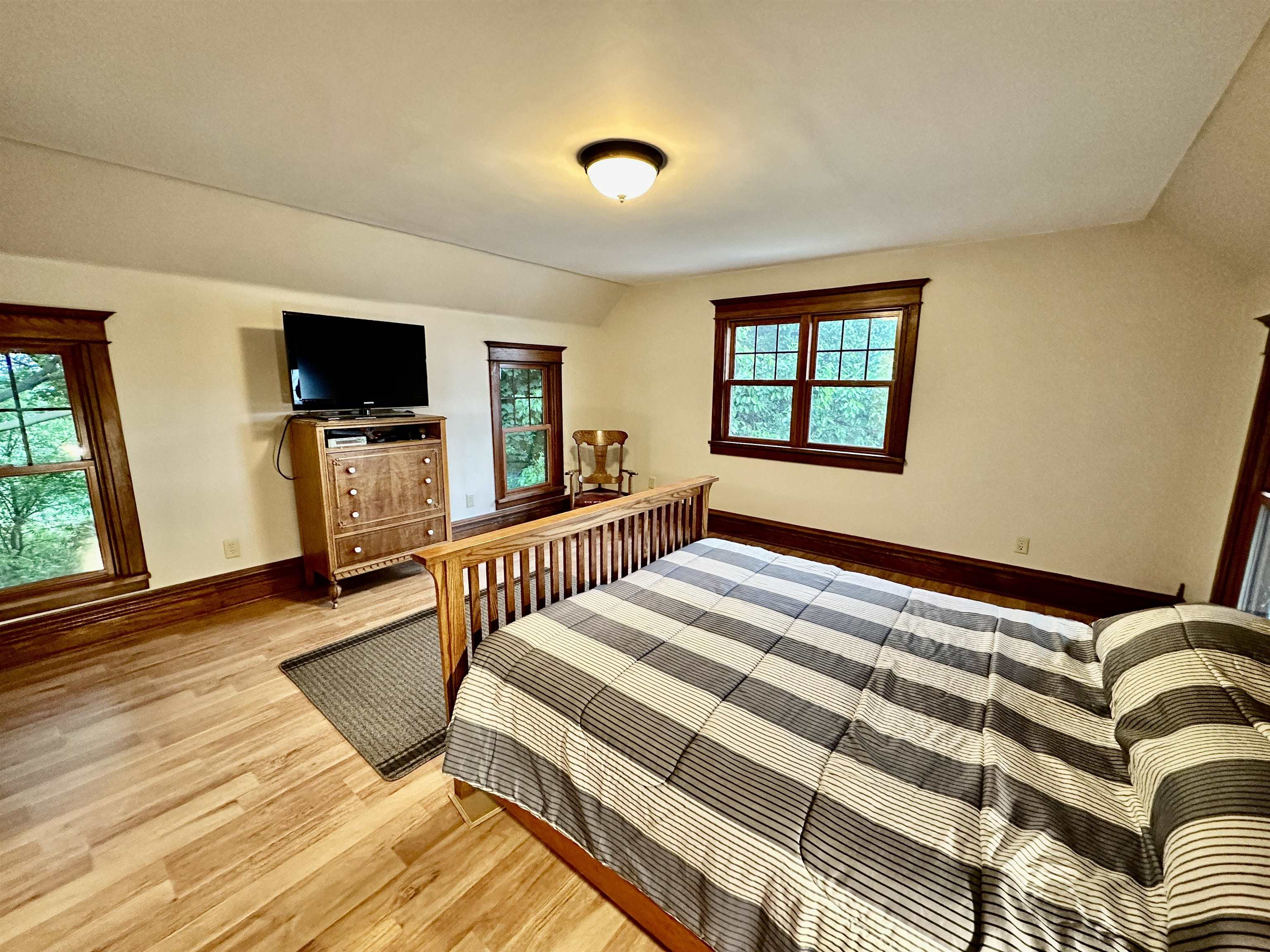 4415 Genoa Road Belvidere, IL 61008 - Photo 25 of 51 a bedroom with a bed and a flat screen tv