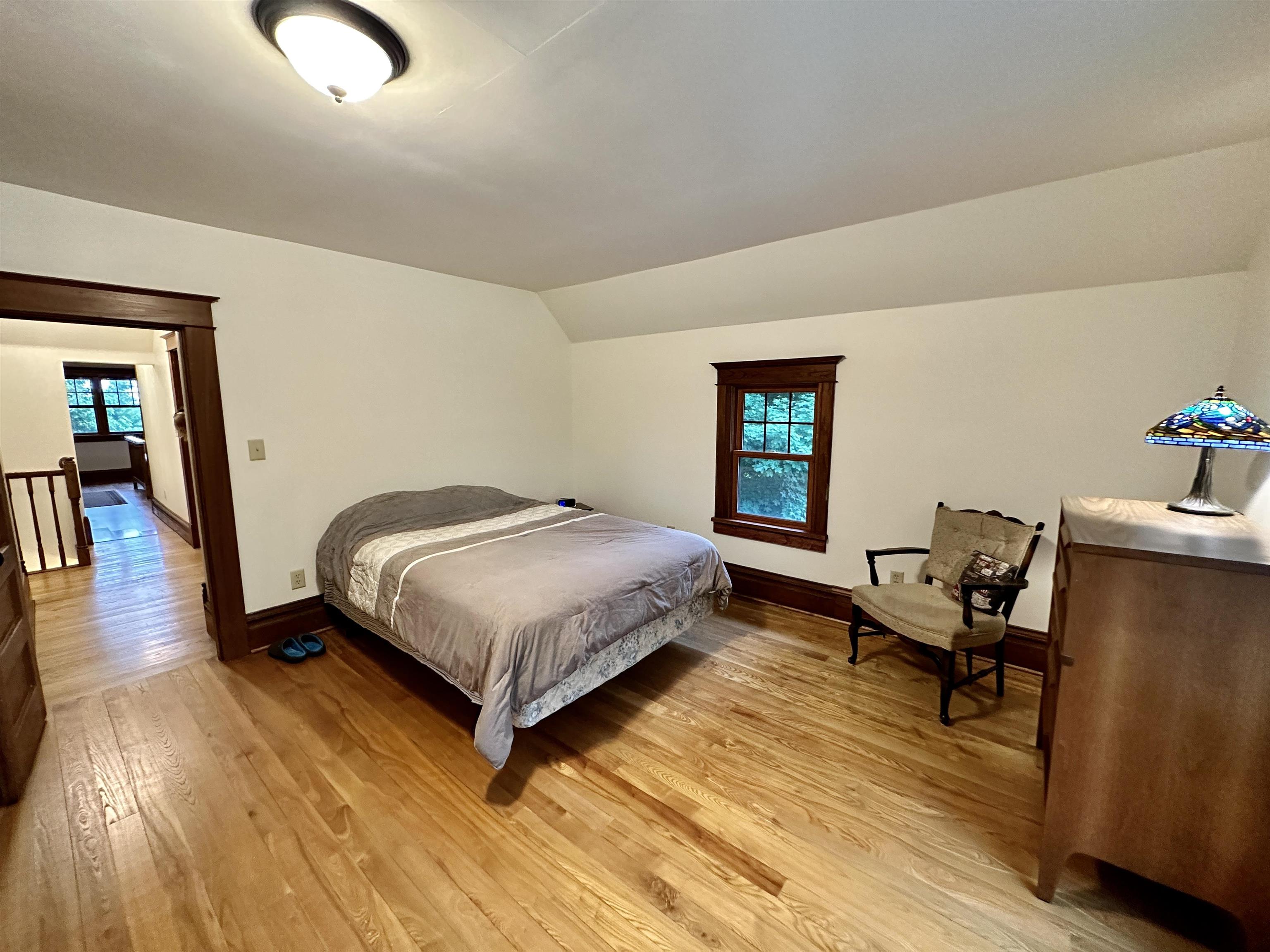 4415 Genoa Road Belvidere, IL 61008 - Photo 29 of 51 a bedroom with a bed and wooden floor
