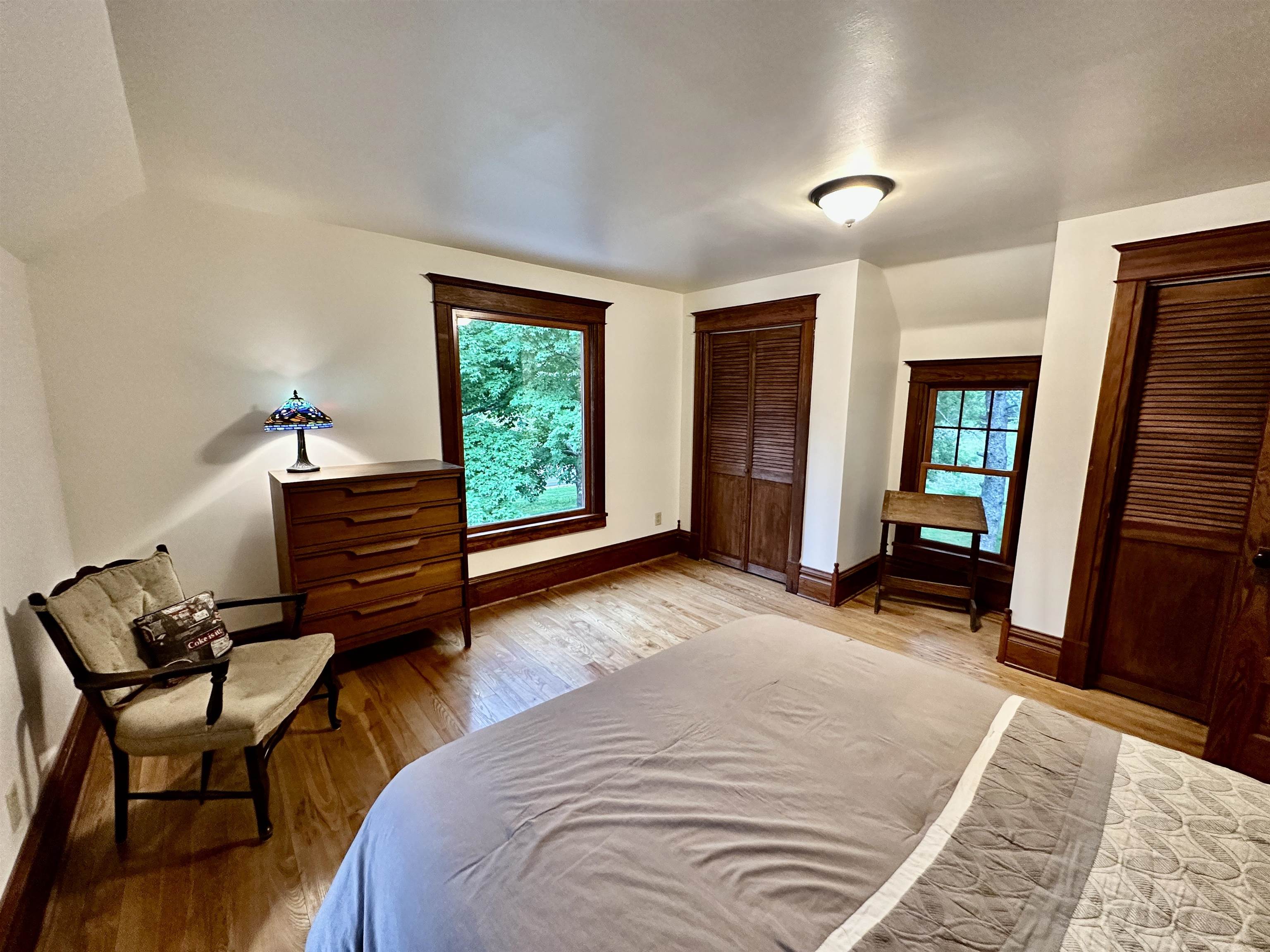 4415 Genoa Road Belvidere, IL 61008 - Photo 31 of 51 a bedroom with a bed and wooden floor