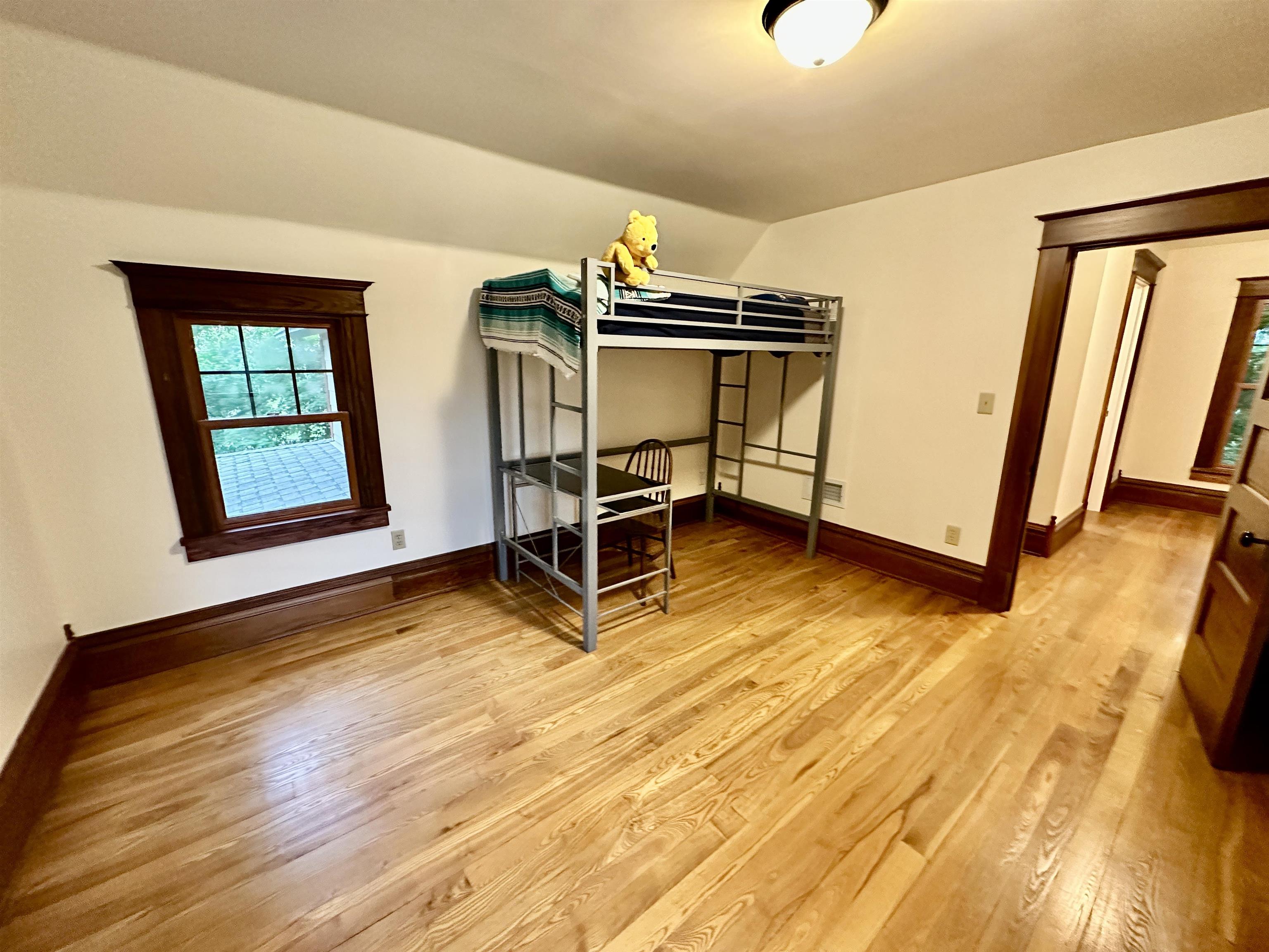 4415 Genoa Road Belvidere, IL 61008 - Photo 32 of 51 a bedroom with wooden floor and furniture