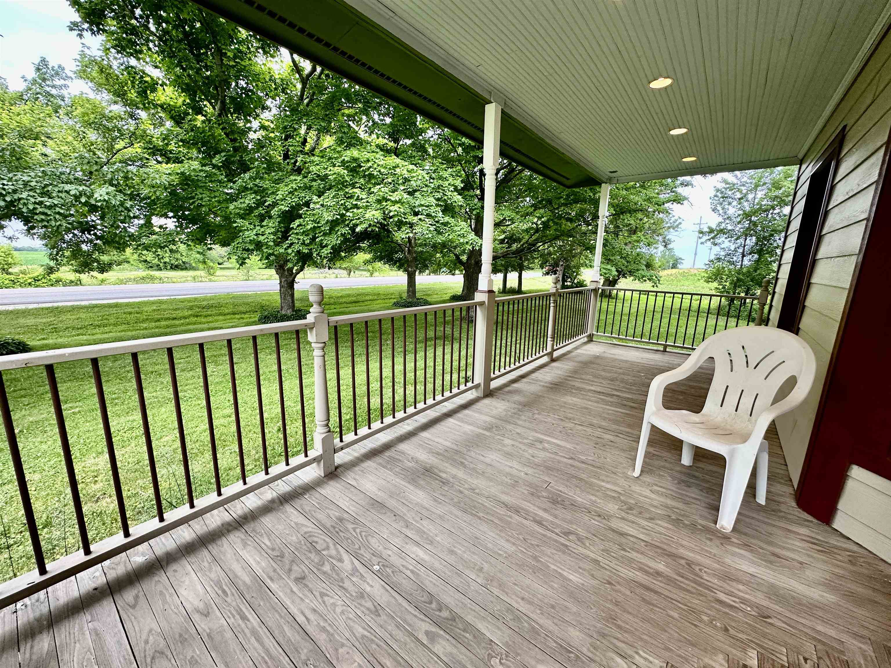 4415 Genoa Road Belvidere, IL 61008 - Photo 6 of 51 a view of a chair and tables in the balcony