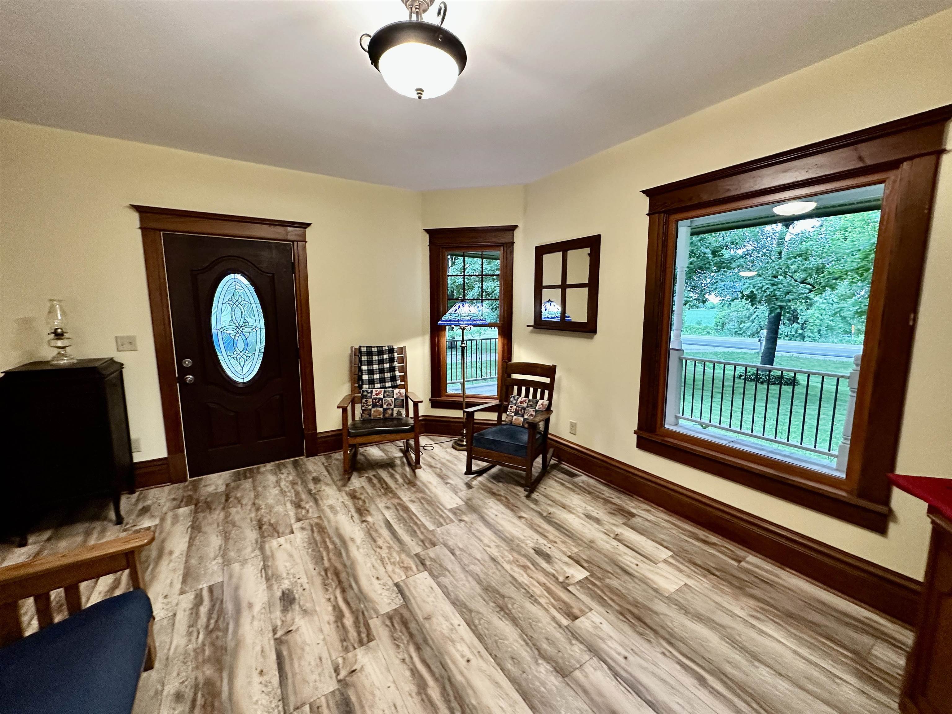 4415 Genoa Road Belvidere, IL 61008 - Photo 7 of 51 a living room with furniture a window and a flat tv screen