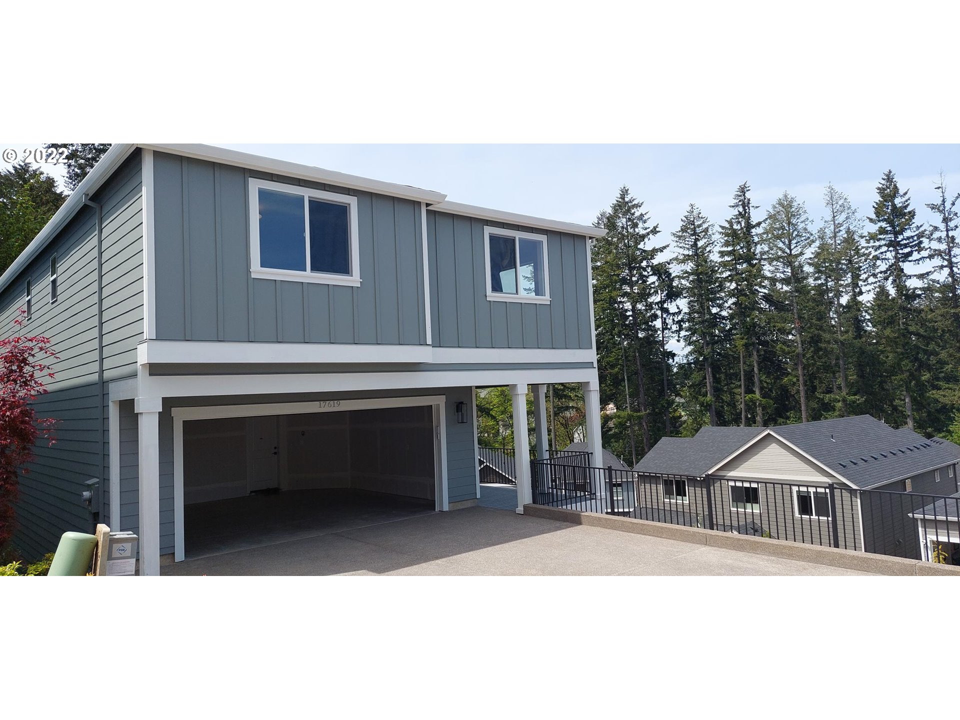 17619 Southwest Sunview Lane Beaverton, OR 97007 - Photo 1 of 1 a house with trees in front of it