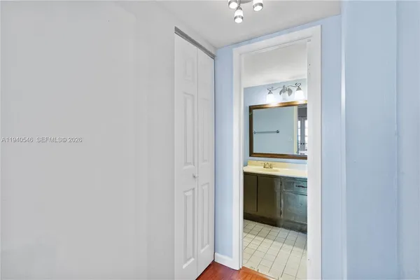 a bathroom with a sink and mirror