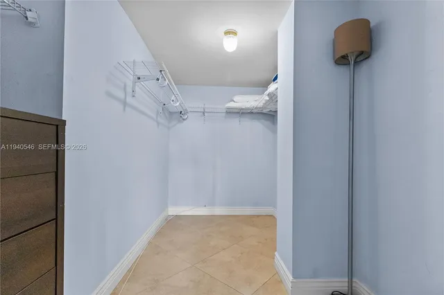 a view of walk in closet with window