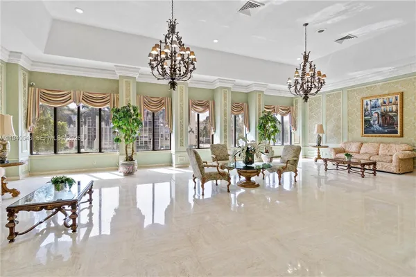 a view of a dining room with furniture chandelier and a chandelier