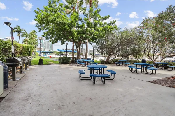 a view of a park with bench and trees