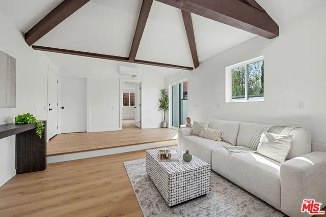 a living room with furniture and a rug